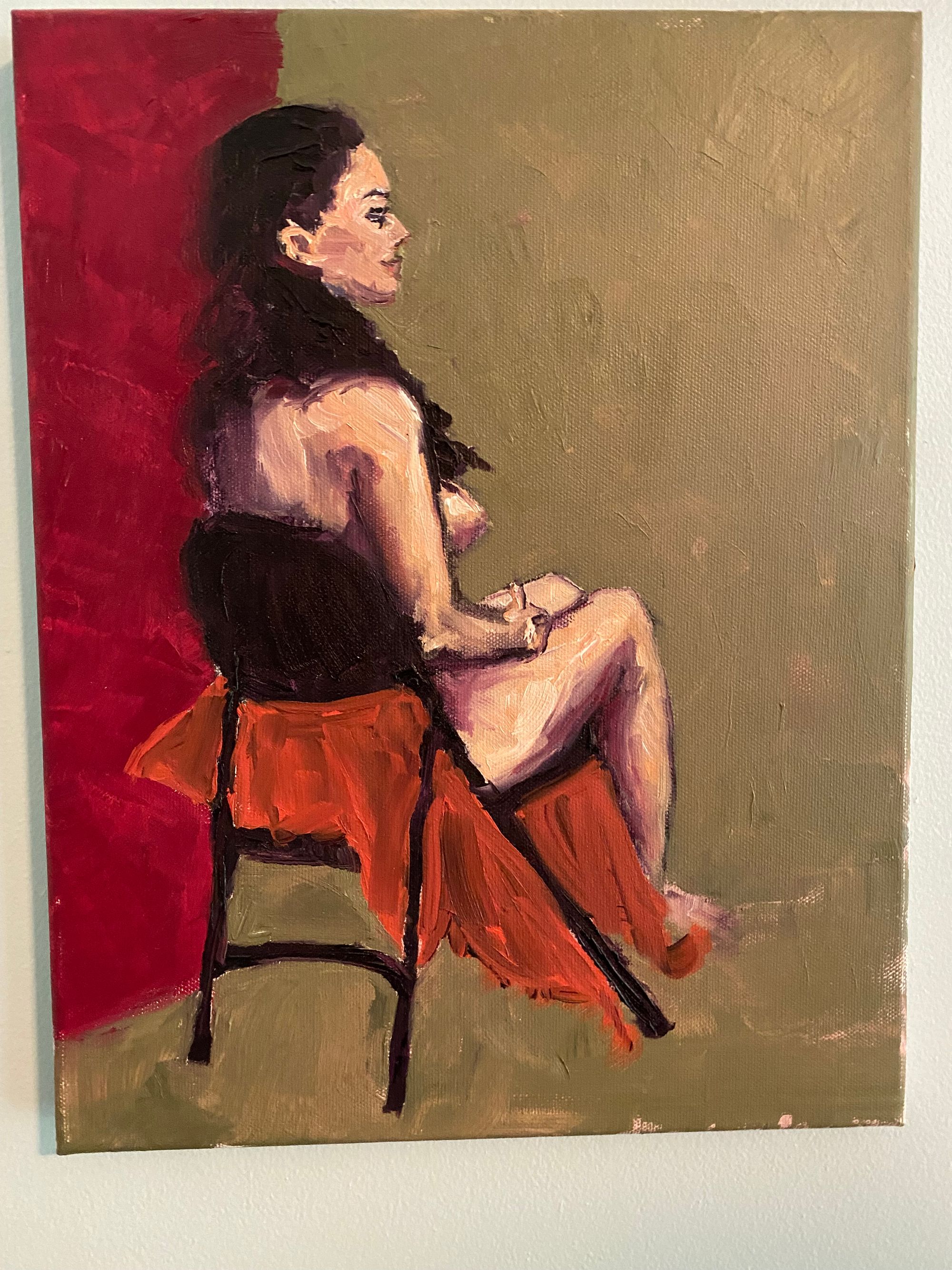 a nude portrait of a woman in a chair 